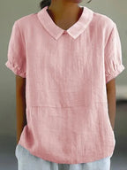 Light pink linen-blend blouse with round Peter Pan collar, cuffed sleeves and a seam detail at the hip