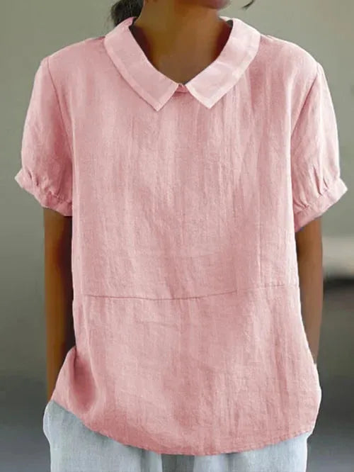 Light pink linen-blend blouse with round Peter Pan collar, cuffed sleeves and a seam detail at the hip