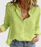 Lime green linen button-down shirt showing the curved hem and soft textured fabric close up