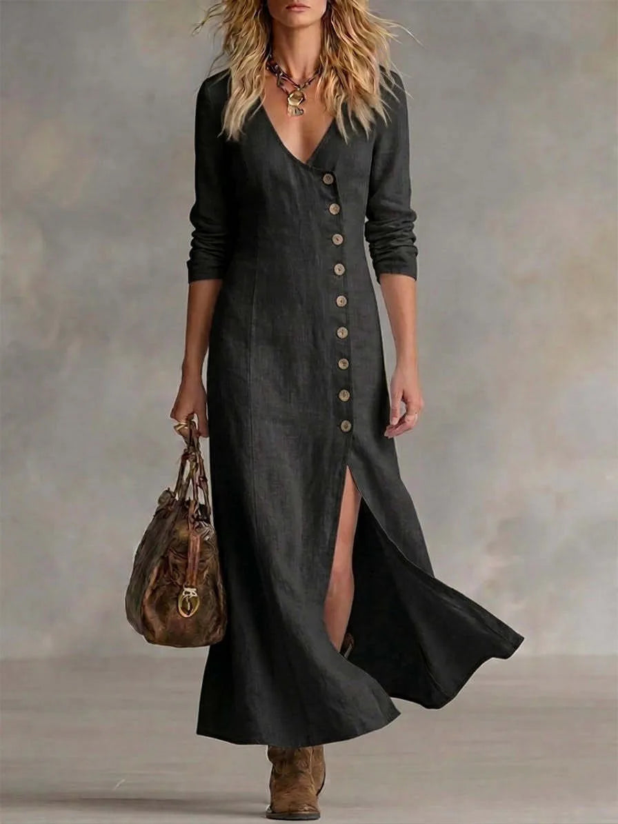 Charcoal black linen maxi dress with V-neckline and front split, worn with a slouchy leather bag