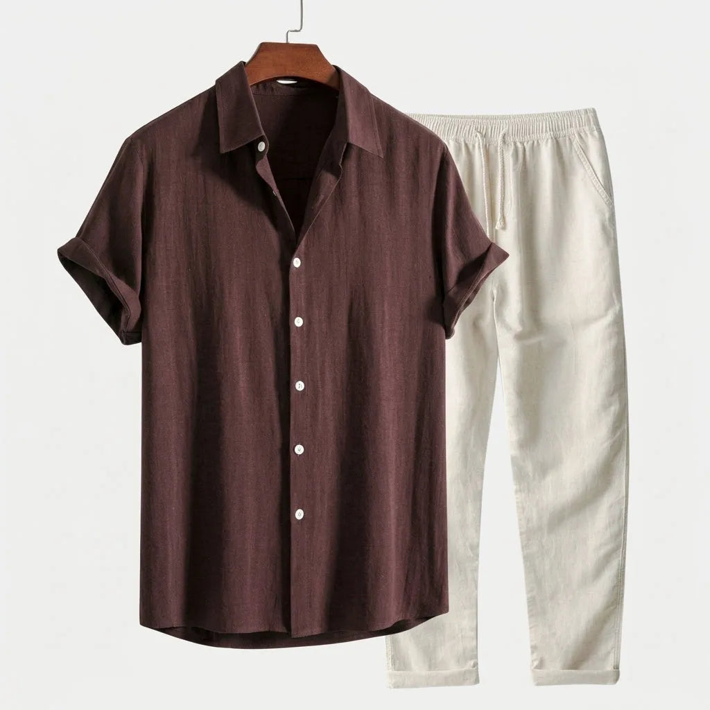 Espresso brown linen short-sleeve shirt with white buttons paired with cream drawstring linen pants on a wooden hanger