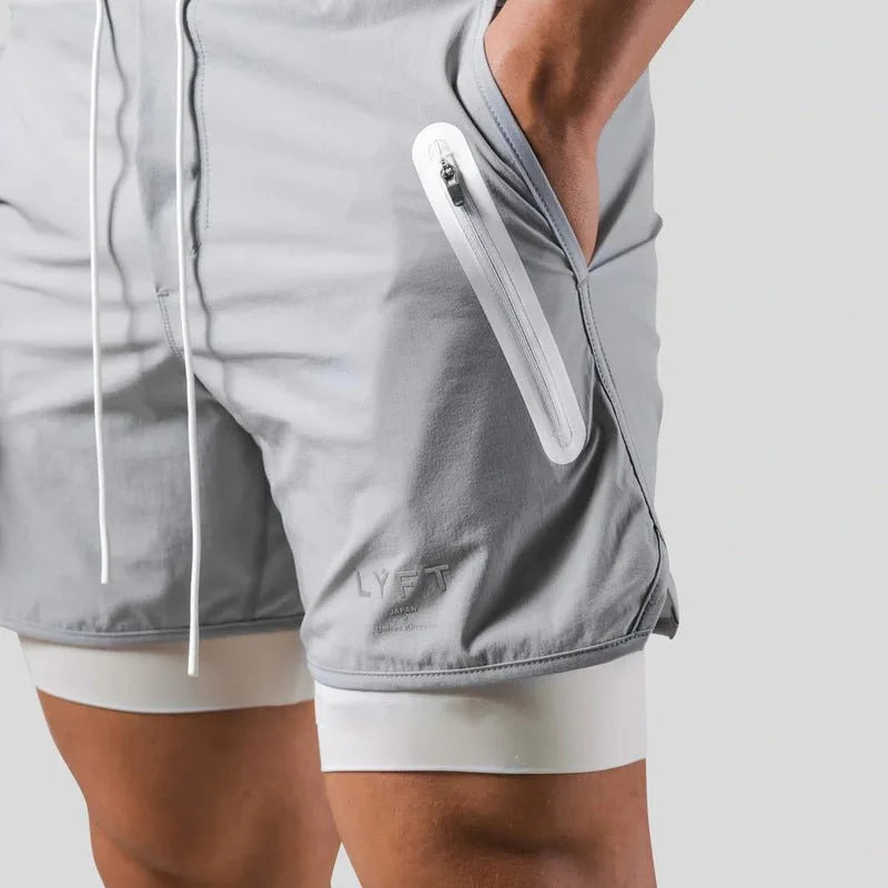 Close-up side view of light grey shorts showing the white zip pocket and contrast liner
