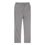Side view of black linen pants showing the straight cut from hip to ankle hem