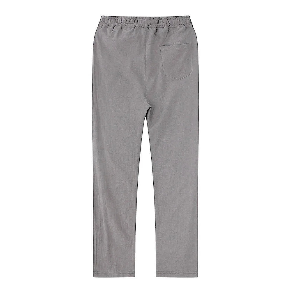 Side view of black linen pants showing the straight cut from hip to ankle hem