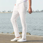 Rear view close-up of light khaki linen pants fabric showing woven linen texture