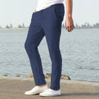 Side view of light blue linen pants showing the ankle length hem and sneaker pairing