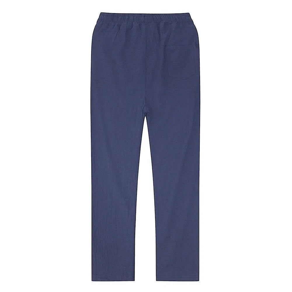 Rear view of light blue linen pants showing even leg taper and smooth unwrinkled fabric