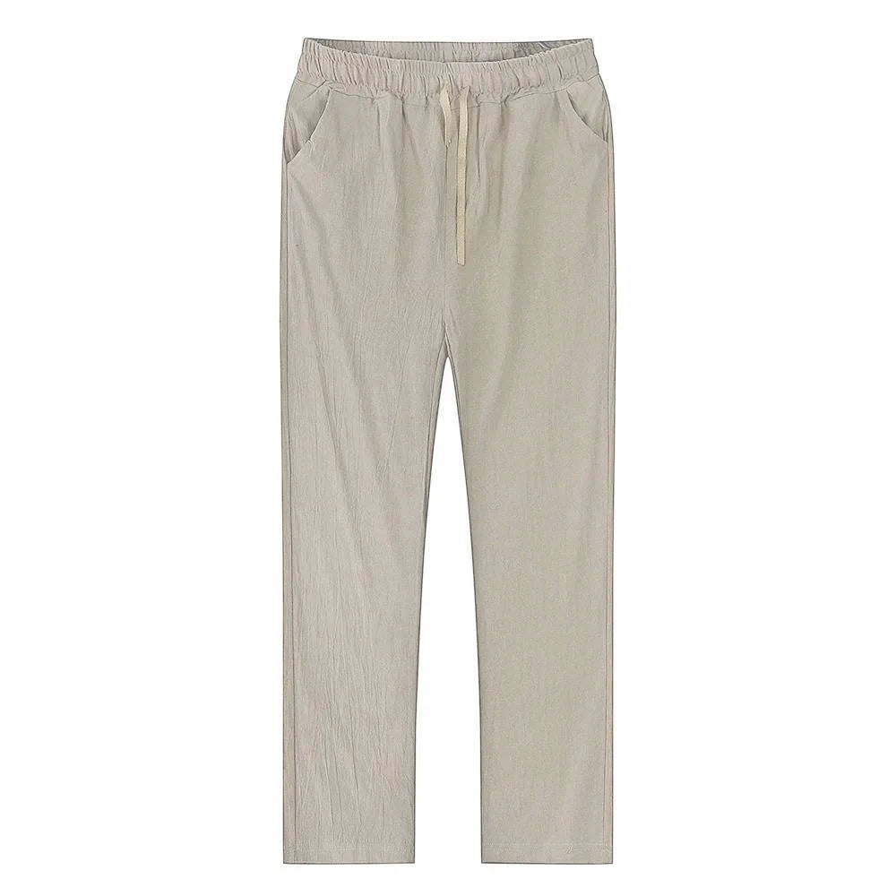 Flat lay front view of light khaki linen pants showing elastic waistband and drawstring closure