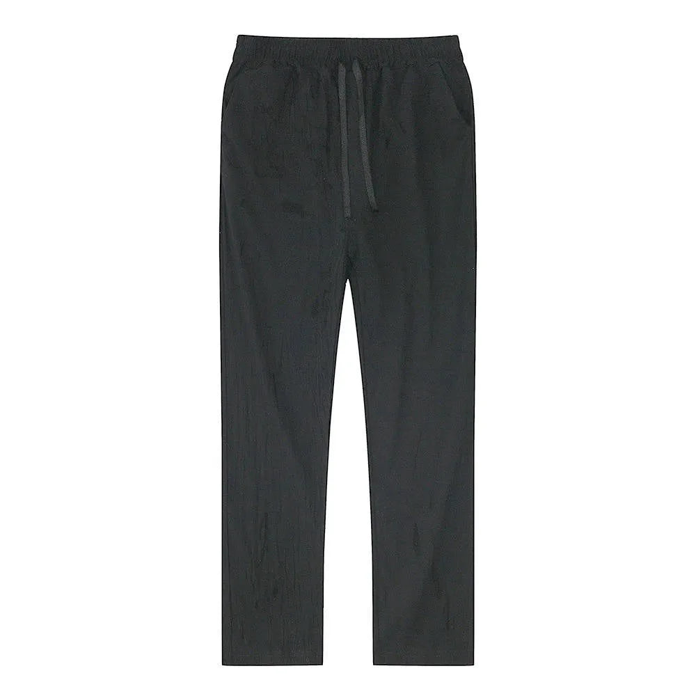 Close rear view of light blue linen pants showing fabric texture and natural creasing