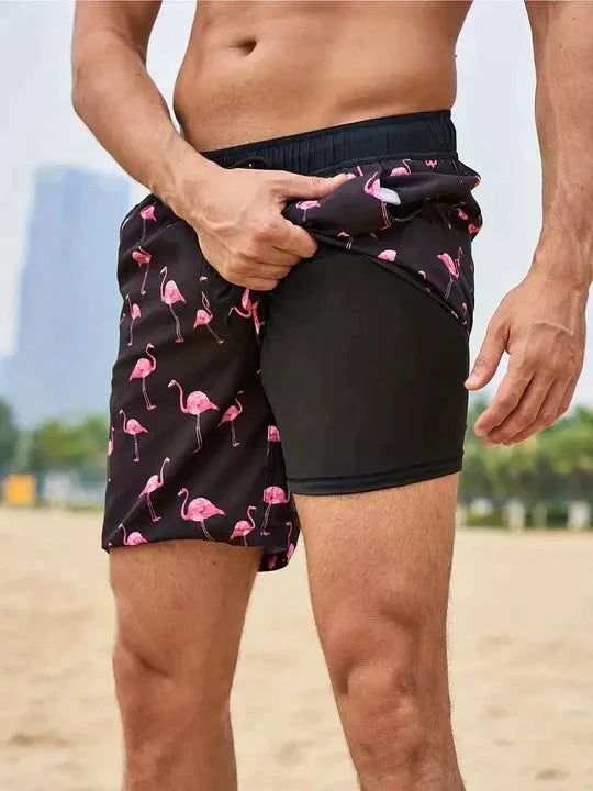 Close-up side view showing the black flamingo print outer short lifted to reveal the black compression liner underneath