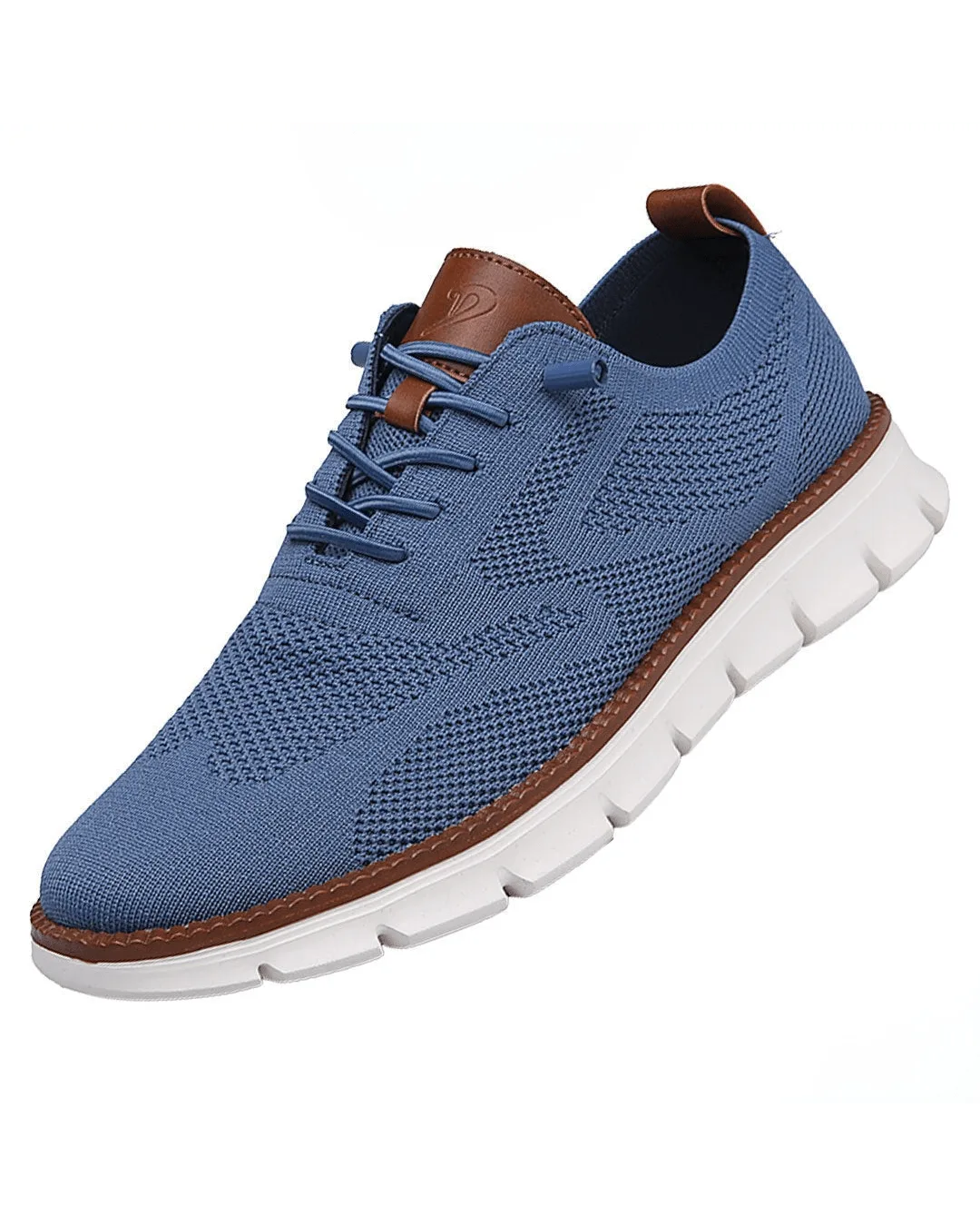 Blue knit sneaker with tan leather lace panel and heel tab, white textured outsole