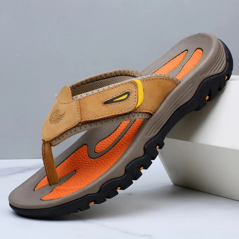Grey suede-look thong sandal with orange insole detail and heavy-duty rubber sole, side profile