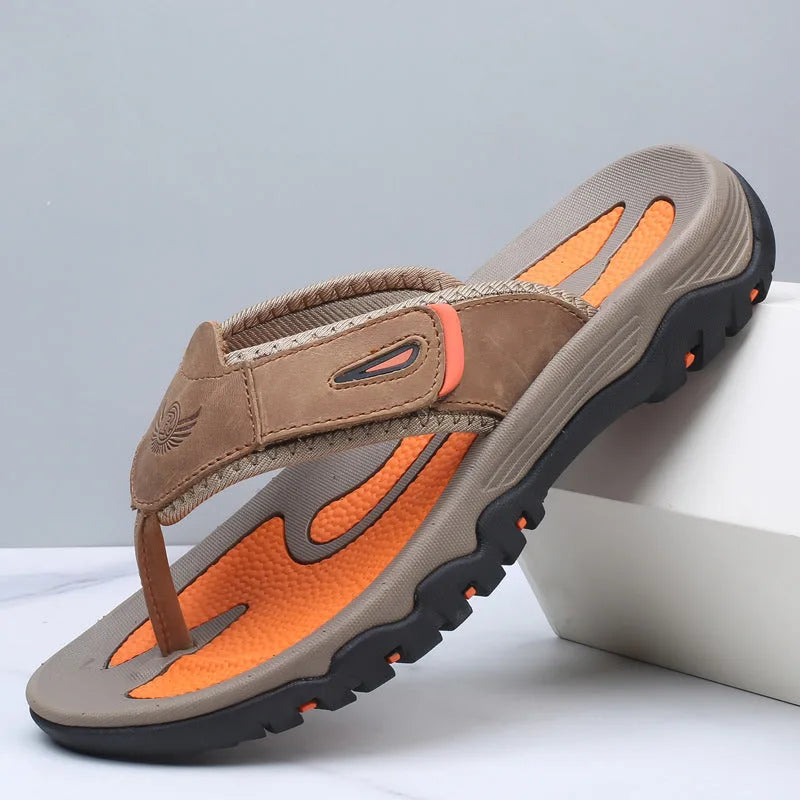 Angled view of camel brown sandal highlighting adjustable strap, embossed logo and lugged outsole