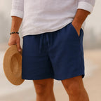 Navy linen-blend shorts with drawstring waistband, close-up view showing relaxed fit and pockets
