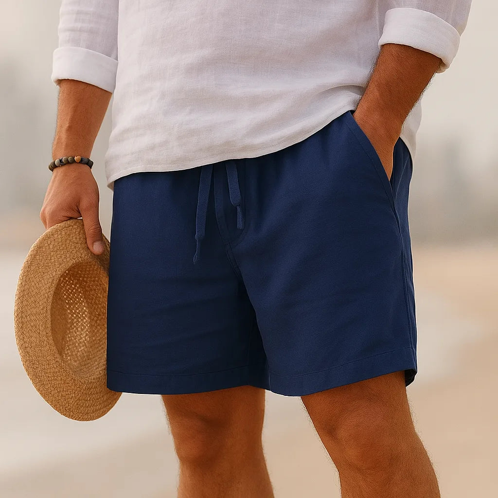 Navy linen-blend shorts with drawstring waistband, close-up view showing relaxed fit and pockets