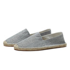 Side view of light grey woven espadrille with jute-wrapped midsole and slip-on fit