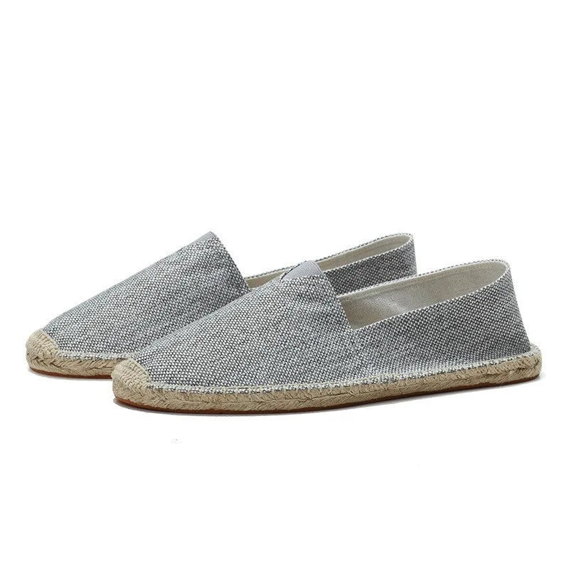 Side view of light grey woven espadrille with jute-wrapped midsole and slip-on fit