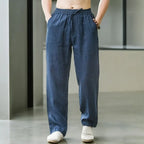 Front view of navy blue linen drawstring pants with elastic waistband and deep front pockets