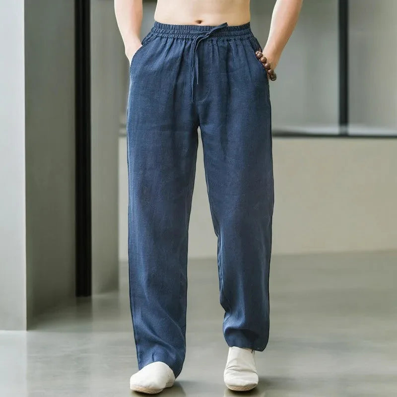 Front view of navy blue linen drawstring pants with elastic waistband and deep front pockets