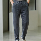 Front view of charcoal grey linen pants with drawstring tie and elastic waistband
