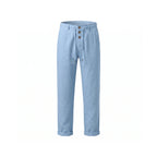 Front view of light blue linen trousers with rolled hems and triple-button fly on a plain background