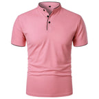 Pink polo shirt with mandarin collar, black trim and buttons, short sleeves, front view on white background