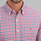 Close-up of the button-down collar and chest pocket detail with contrast flag emblem