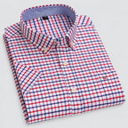 Folded shirt showing the check pattern, mother-of-pearl style buttons and contrast inner collar trim