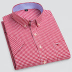 Folded red and white gingham shirt showing the striped inner collar lining and button placket