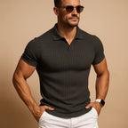 Charcoal grey ribbed knit polo shirt on a man wearing sunglasses, open collar design with slim short sleeves