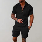 Black textured polo and shorts two-piece set, front view highlighting the zip collar detail