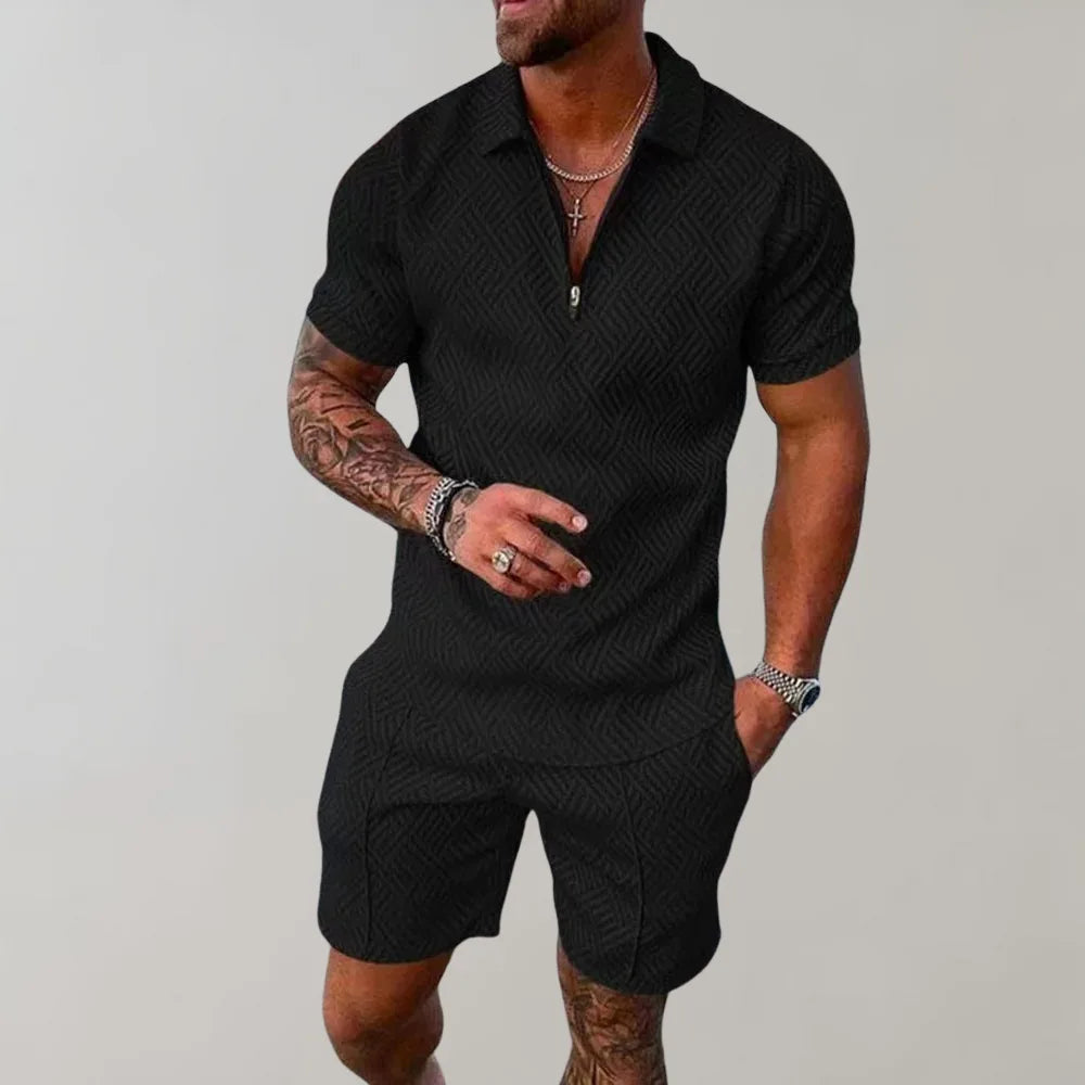 Black textured polo and shorts two-piece set, front view highlighting the zip collar detail