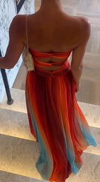 Close-up back view showing the triple knotted waist straps and open back cutouts of the ombre chiffon maxi dress.