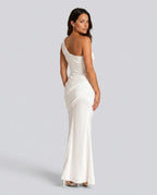 Back view of ivory white one-shoulder maxi dress showing low back line and gathered waist drape