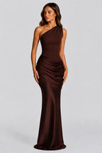 Front view of deep brown one-shoulder satin maxi dress with ruched waist and fitted bodice