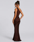 Back view of deep brown one-shoulder maxi dress showing ruched drape detail along the hip