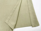 Additional close-up of the sage green fabric drape showing the soft structured texture of the material