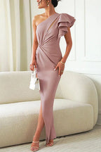 Side view of the apricot ruffle-shoulder dress showing the draped waist detail and open side slit over heeled sandals.