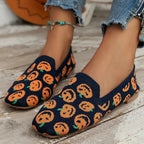 Pair of textured knit slip-on loafers arranged together showing stitched seam detailing