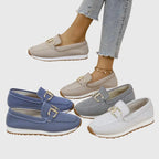 Side profile of a blue knit slip-on loafer showing the white midsole and textured rubber outsole