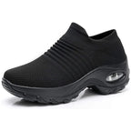 Mixed black and grey marled knit sneaker with a grey sole and air cushion detail