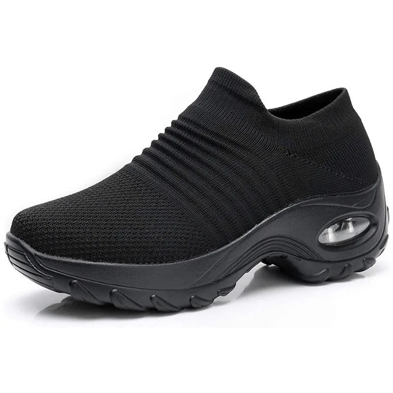 Mixed black and grey marled knit sneaker with a grey sole and air cushion detail