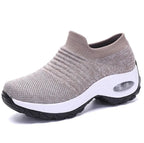 Black knitted sneaker with a contrasting white chunky sole and visible air cushion unit