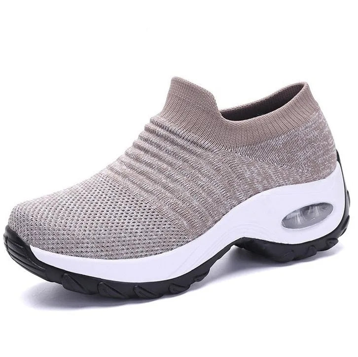 Black knitted sneaker with a contrasting white chunky sole and visible air cushion unit
