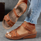Brown wedge sandal with stacked heel and visible topstitching, displayed next to the matching sole underside