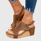 Top-down close-up of beige sandal showing open toe design and soft cushioned footbed