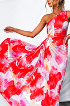 Close-up of the floral print pleated fabric and draped skirt movement of the one-shoulder dress