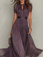 Close-up of the gathered high neckline with keyhole opening, lace trim and short puff sleeves