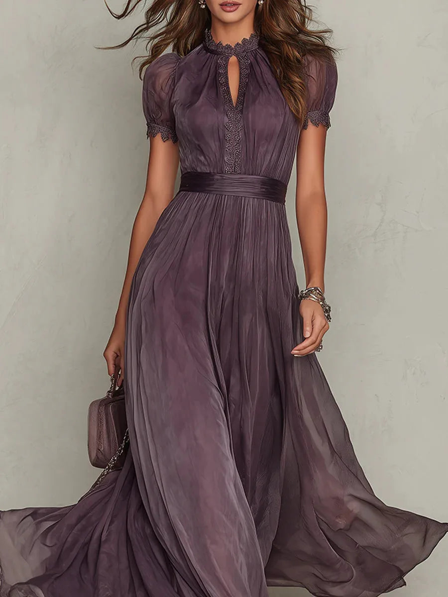 Close-up of the gathered high neckline with keyhole opening, lace trim and short puff sleeves