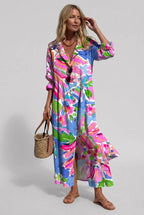 Woman in a blue, pink and green abstract floral printed shirt dress with pintuck front and puffed sleeves